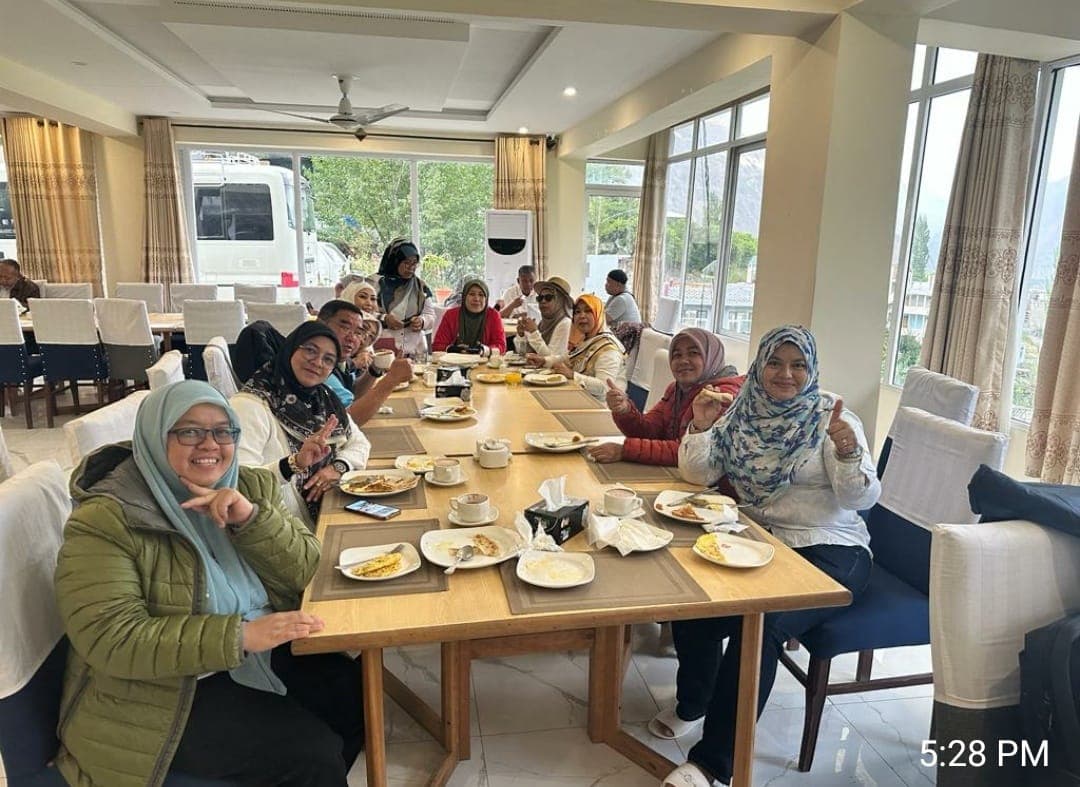 International guests sharing breakfast at Hilltop Hotel Hunza